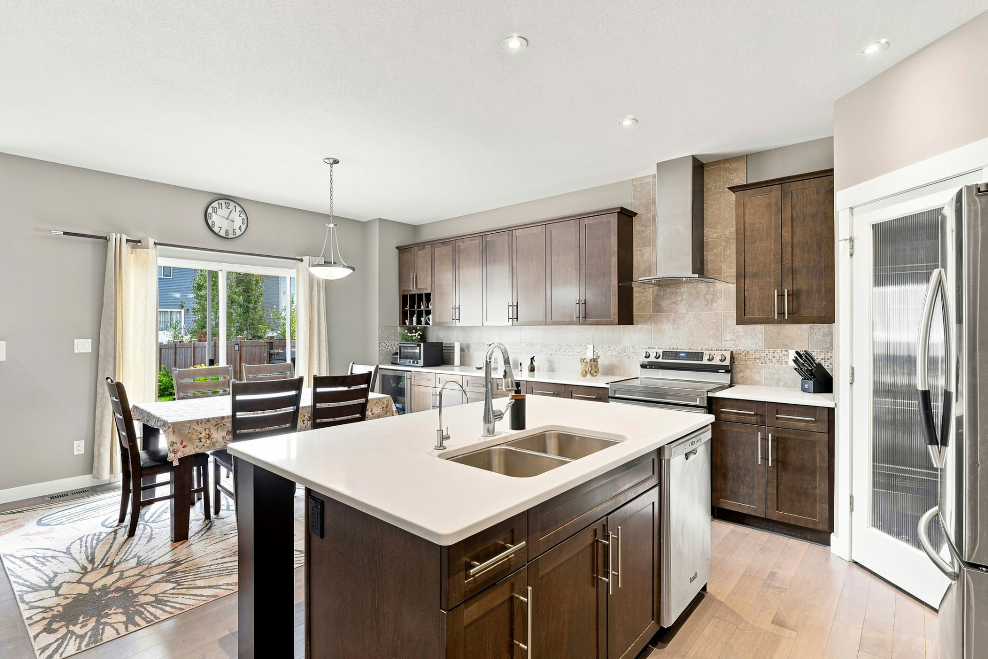 Kitchen island and dining area at 5433 Green Alder Way